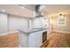 Open kitchen island with a cooktop, granite countertops, and ample storage, perfect for culinary enthusiasts at 446 Waterford Nw Rd, Atlanta, GA 30318