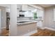 Well-equipped kitchen featuring modern appliances, granite counters, and a convenient breakfast bar at 446 Waterford Nw Rd, Atlanta, GA 30318