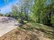 View of the grass backyard and trees surrounding the perimeter of the property at 579 Fielding Ln, Atlanta, GA 30311