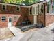 The home has a brick exterior, outdoor air conditioners and a concrete patio at 579 Fielding Ln, Atlanta, GA 30311