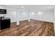 Well-lit basement featuring laminate floors, ample open space, and a convenient kitchenette area at 579 Fielding Ln, Atlanta, GA 30311