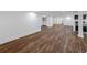 Spacious finished basement with durable, wood-look flooring and modern lighting fixtures at 579 Fielding Ln, Atlanta, GA 30311