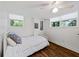 Basement bedroom with a neutral palette, natural lighting, and laminate floors at 579 Fielding Ln, Atlanta, GA 30311