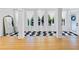 Stylish entryway boasts black and white geometric tile flooring, white columns, and bright windows with natural light at 579 Fielding Ln, Atlanta, GA 30311