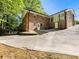 The brick house features a long driveway and back entrance at 579 Fielding Ln, Atlanta, GA 30311