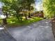 View of the home's lush front lawn and trees at 579 Fielding Ln, Atlanta, GA 30311