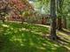 Classic brick home with a neatly landscaped front yard and mature trees at 579 Fielding Ln, Atlanta, GA 30311
