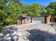 View of the exterior showcasing the brick siding, chimney, garage, and driveway at 579 Fielding Ln, Atlanta, GA 30311