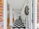 Elegant entry featuring black and white tile and white pillars at 579 Fielding Ln, Atlanta, GA 30311