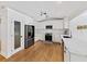 This kitchen features white cabinets, a subway tile backsplash, stainless appliances, track lights, and light hardwood floors at 579 Fielding Ln, Atlanta, GA 30311