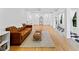 Spacious living room with hardwood floors, elegant pillars, stylish decor, and large windows for bright, natural light at 579 Fielding Ln, Atlanta, GA 30311