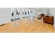 Expansive living area features hardwood floors, geometric tile accents, and large windows for ample natural light at 579 Fielding Ln, Atlanta, GA 30311