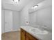 Bathroom features a large mirror and a vanity with a sink and storage cabinets at 1008 Hope Springs Ct, Stone Mountain, GA 30083