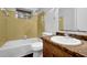 Bathroom showcases a vanity with a sink, toilet, and a tub-shower combination with tile walls at 1008 Hope Springs Ct, Stone Mountain, GA 30083