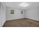 Bedroom with neutral carpet, light walls, double windows, and closet space, for a comfortable retreat at 1008 Hope Springs Ct, Stone Mountain, GA 30083