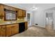 Well-lit kitchen featuring a stainless steel sink and black appliances at 1008 Hope Springs Ct, Stone Mountain, GA 30083