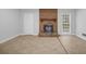 Spacious living area features a brick fireplace and ample natural light at 1008 Hope Springs Ct, Stone Mountain, GA 30083