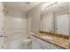 Full bath with granite countertop, vanity, and shower-tub combo at 1316 Durham Ter, Mcdonough, GA 30252