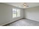 Carpeted bedroom with a ceiling fan and natural light at 1316 Durham Ter, Mcdonough, GA 30252