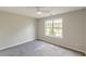 Bedroom featuring neutral walls, plush carpeting, and a window for natural light at 1316 Durham Ter, Mcdonough, GA 30252