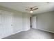 Bedroom with neutral colors, carpet and two entry doors at 1316 Durham Ter, Mcdonough, GA 30252