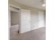 Bedroom showing doors leading to other rooms, with soft gray carpet and neutral paint at 1316 Durham Ter, Mcdonough, GA 30252