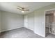 Bedroom with neutral colors, ceiling fan, and access to hallway at 1316 Durham Ter, Mcdonough, GA 30252