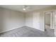Bedroom with a ceiling fan, neutral walls and carpeting, and two access doors at 1316 Durham Ter, Mcdonough, GA 30252