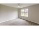 Bright bedroom featuring neutral walls, a ceiling fan, a large window, and plush carpeting at 1316 Durham Ter, Mcdonough, GA 30252