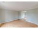 Bright living room with hardwood floors, light gray walls, and white trim at 1316 Durham Ter, Mcdonough, GA 30252