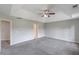 Expansive main bedroom with neutral walls, carpeting, and a tray ceiling with a fan at 1316 Durham Ter, Mcdonough, GA 30252