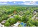 Aerial view of this home, the community pool, the tennis courts and lush landscaping at 1431 Waterford Green Dr, Marietta, GA 30068