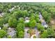 Aerial view of the community pool and surrounding lush, green trees at 1431 Waterford Green Dr, Marietta, GA 30068