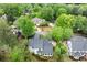 Aerial view highlighting a beautiful home nestled among mature trees at 1431 Waterford Green Dr, Marietta, GA 30068