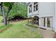 The home has a manicured backyard, covered patio, and double glass doors at 1431 Waterford Green Dr, Marietta, GA 30068