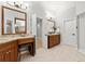 Bright and spacious bathroom with dual vanities, granite countertops, and wood cabinetry at 1431 Waterford Green Dr, Marietta, GA 30068