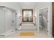 Relaxing bathroom featuring separate shower and tub, granite countertops, and elegant fixtures at 1431 Waterford Green Dr, Marietta, GA 30068