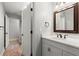 Bathroom with a vanity and a door leading to an additional room with hardwood floors at 1431 Waterford Green Dr, Marietta, GA 30068
