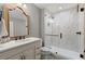 Elegant bathroom featuring a tiled shower, vanity with mirror, and modern fixtures at 1431 Waterford Green Dr, Marietta, GA 30068