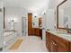 Expansive bathroom features dual vanities, separate tub, shower, and wood cabinetry at 1431 Waterford Green Dr, Marietta, GA 30068