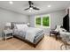 Bright bedroom with a large window offering a view of lush greenery and natural light at 1431 Waterford Green Dr, Marietta, GA 30068