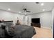 Spacious bedroom featuring hardwood floors, a ceiling fan, and a comfortable bed at 1431 Waterford Green Dr, Marietta, GA 30068