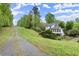 Exterior of home featuring a long driveway, white paint and many windows at 1431 Waterford Green Dr, Marietta, GA 30068