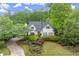 Charming home showcasing a well-manicured lawn and mature landscaping at 1431 Waterford Green Dr, Marietta, GA 30068
