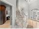 Bright foyer with a winding staircase, decorative glass front door, and hardwood floors, showcasing an inviting entrance at 1431 Waterford Green Dr, Marietta, GA 30068