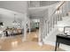 Elegant foyer featuring grand staircase, dining area, and hardwood floors at 1431 Waterford Green Dr, Marietta, GA 30068