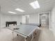 Basement game room with a ping pong table and foosball table provides entertainment at 1431 Waterford Green Dr, Marietta, GA 30068