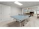 Basement game room boasts a ping pong table, and neutral carpet with an open floorplan at 1431 Waterford Green Dr, Marietta, GA 30068