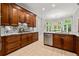 Updated kitchen with granite countertops, stainless steel appliances, and bright white flooring at 1431 Waterford Green Dr, Marietta, GA 30068