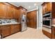 Modern kitchen featuring stainless steel appliances and ample custom wood cabinet storage at 1431 Waterford Green Dr, Marietta, GA 30068